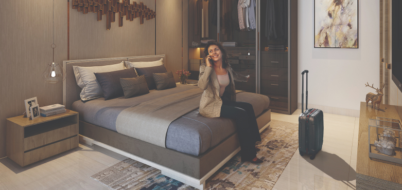 Modern living–dining layout in a Runwal One 1 bhk apartment in Thane with wood textures, plush seating and soft lighting.