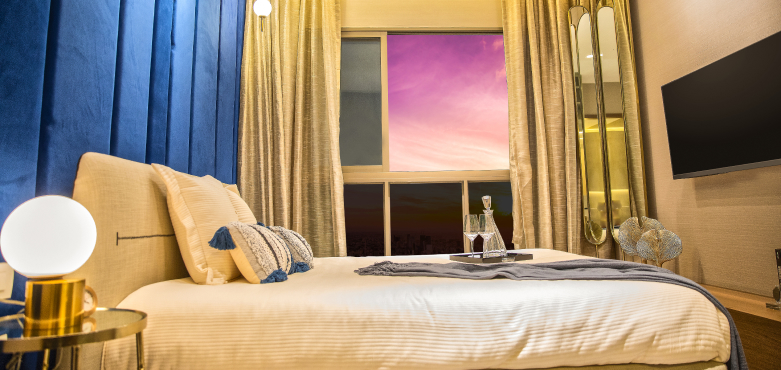 Stylish living–dining space in a Runwal One 2 bhk apartment in Thane with elegant furniture, warm tones and soft lighting.