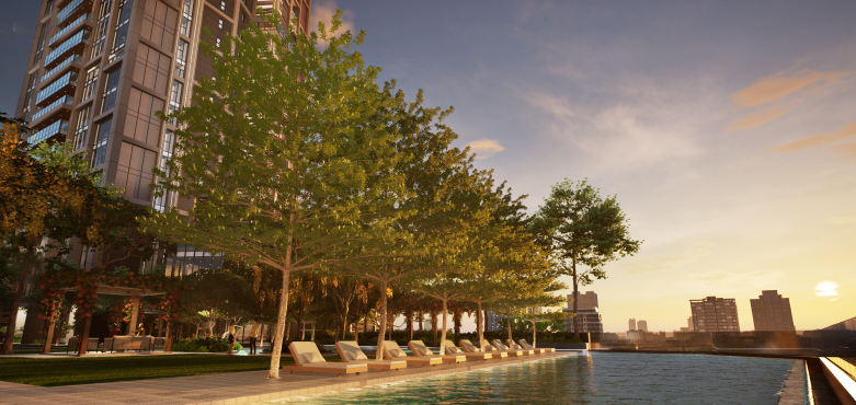 Tranquil pool area encircled by greenery, showcasing available flats for sale in Worli.